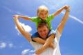 das Bild zu 'He is a father.' auf Deutsch